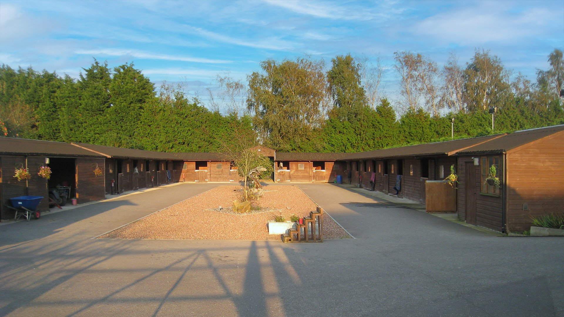 outdoor courtyard stables with wooden cladding