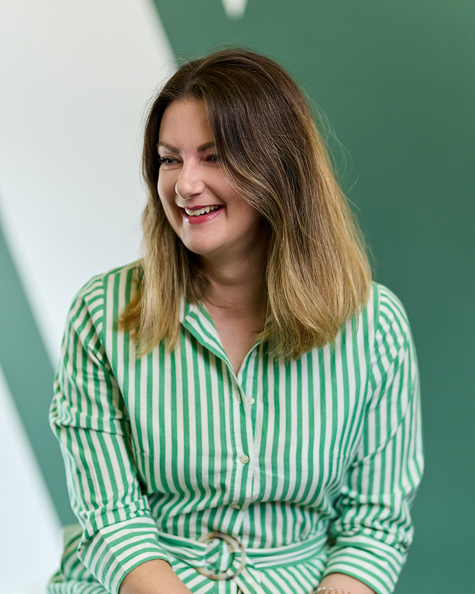 lady in white and green shirt dress