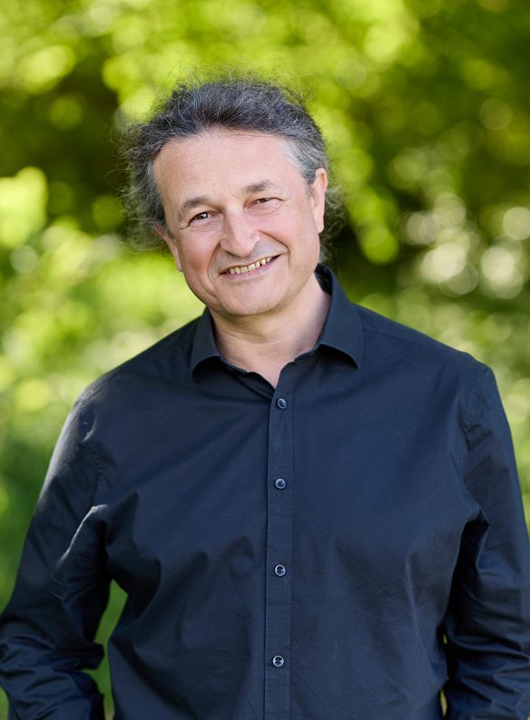 Man smiling in black shirt