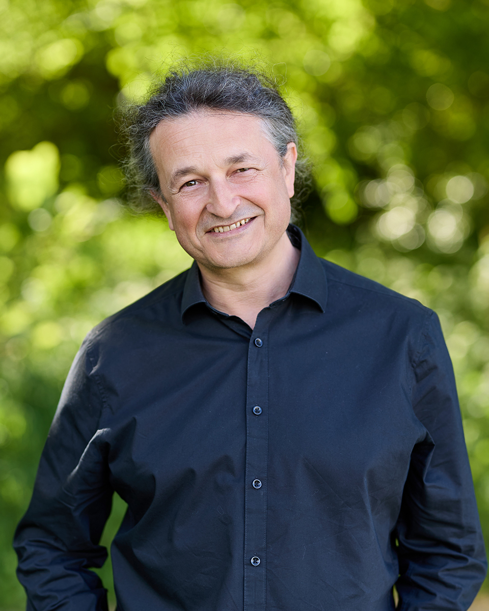 Man smiling in black shirt