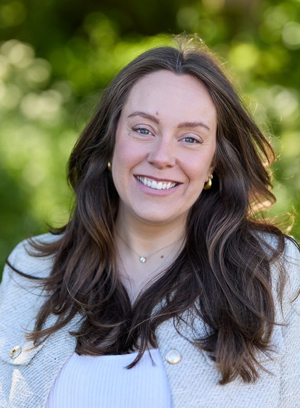 smiling lady with brown flowing hair