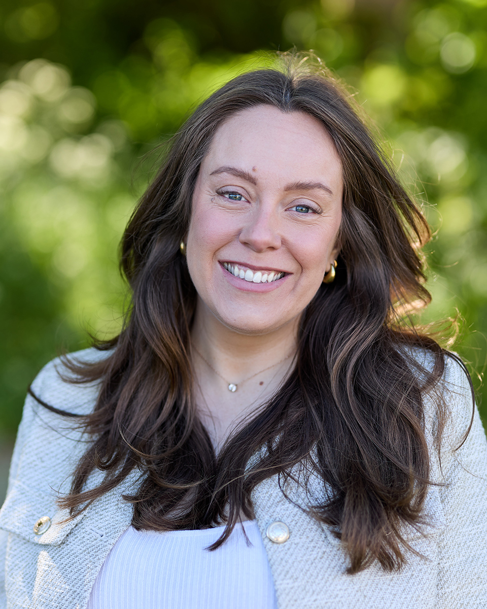 smiling lady with brown flowing hair