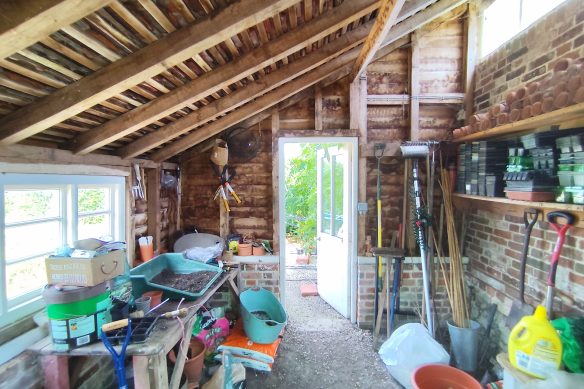interior of a potting shed, with equipment and pots