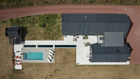 aerial plan view of home showing roofing, swimming pool and patio