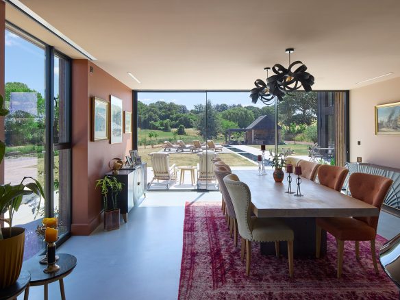 Dining room with a large full height window overlooking the garden